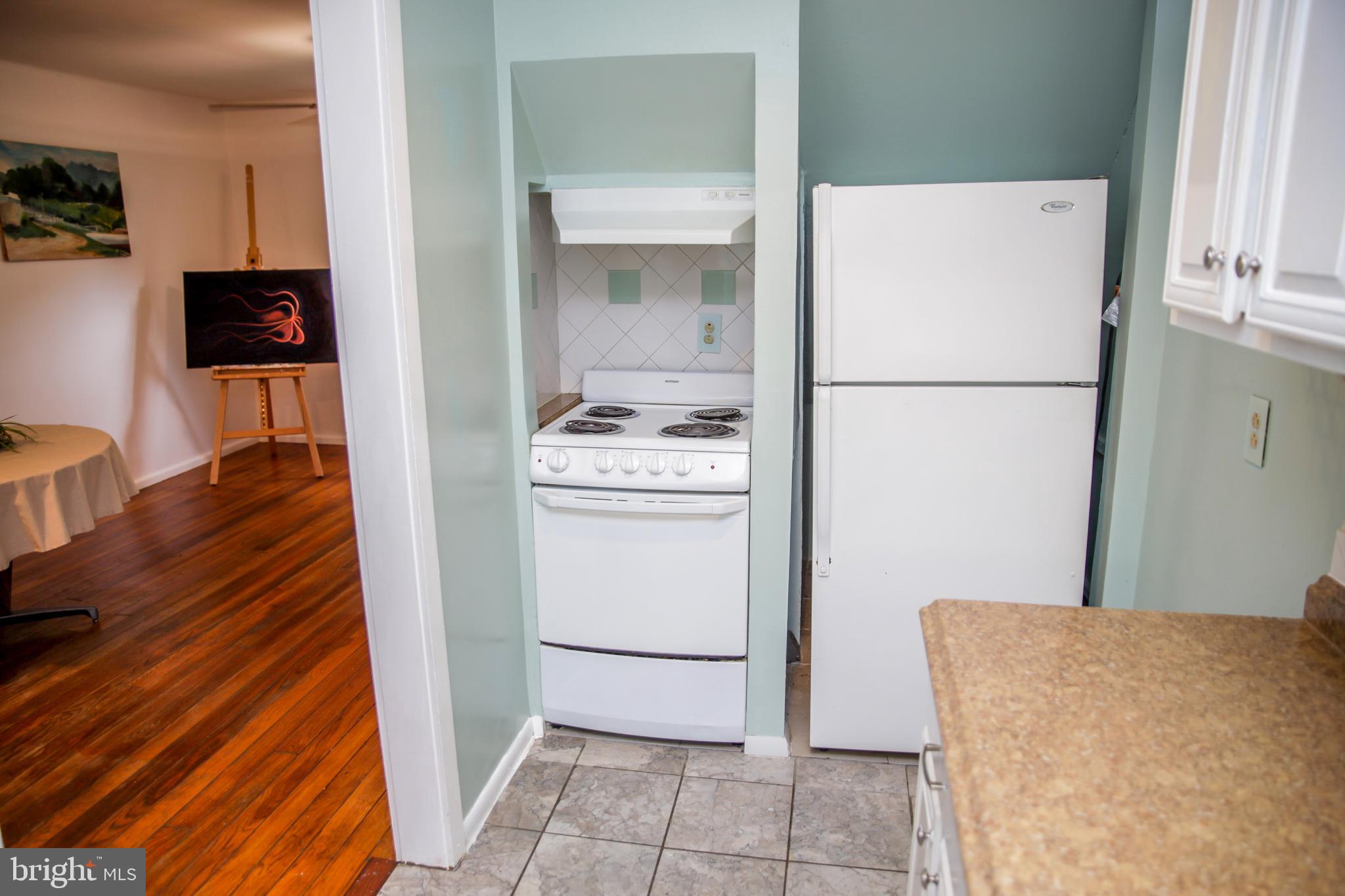 51 Ridge Road, Unit C Greenbelt, MD 20770 - Photo 5 of 27 Fridge, stove tuck into the end of the kitchen.