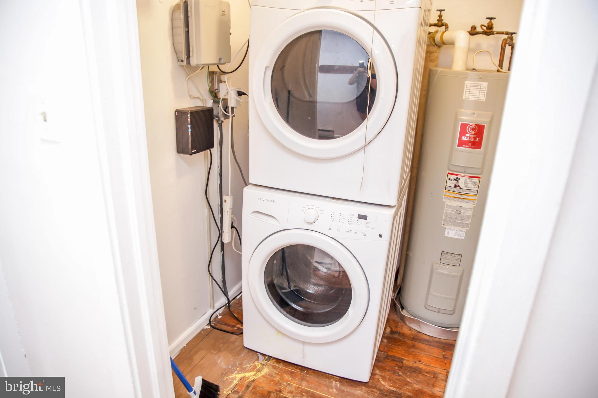 51 Ridge Road, Unit C Greenbelt, MD 20770 - Photo 7 of 27 Full-sized stackable laundry in utility closet