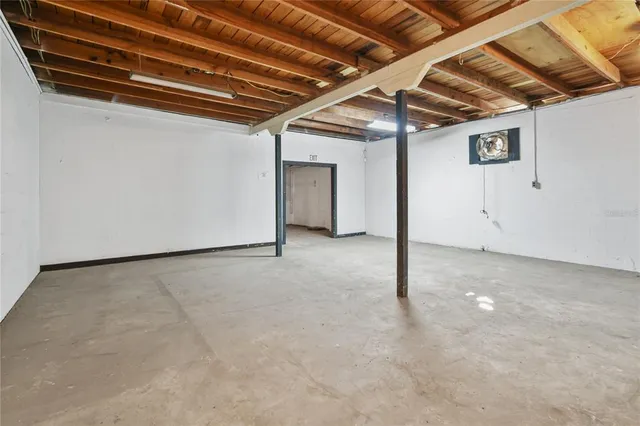 a view of a livingroom with wooden furniture