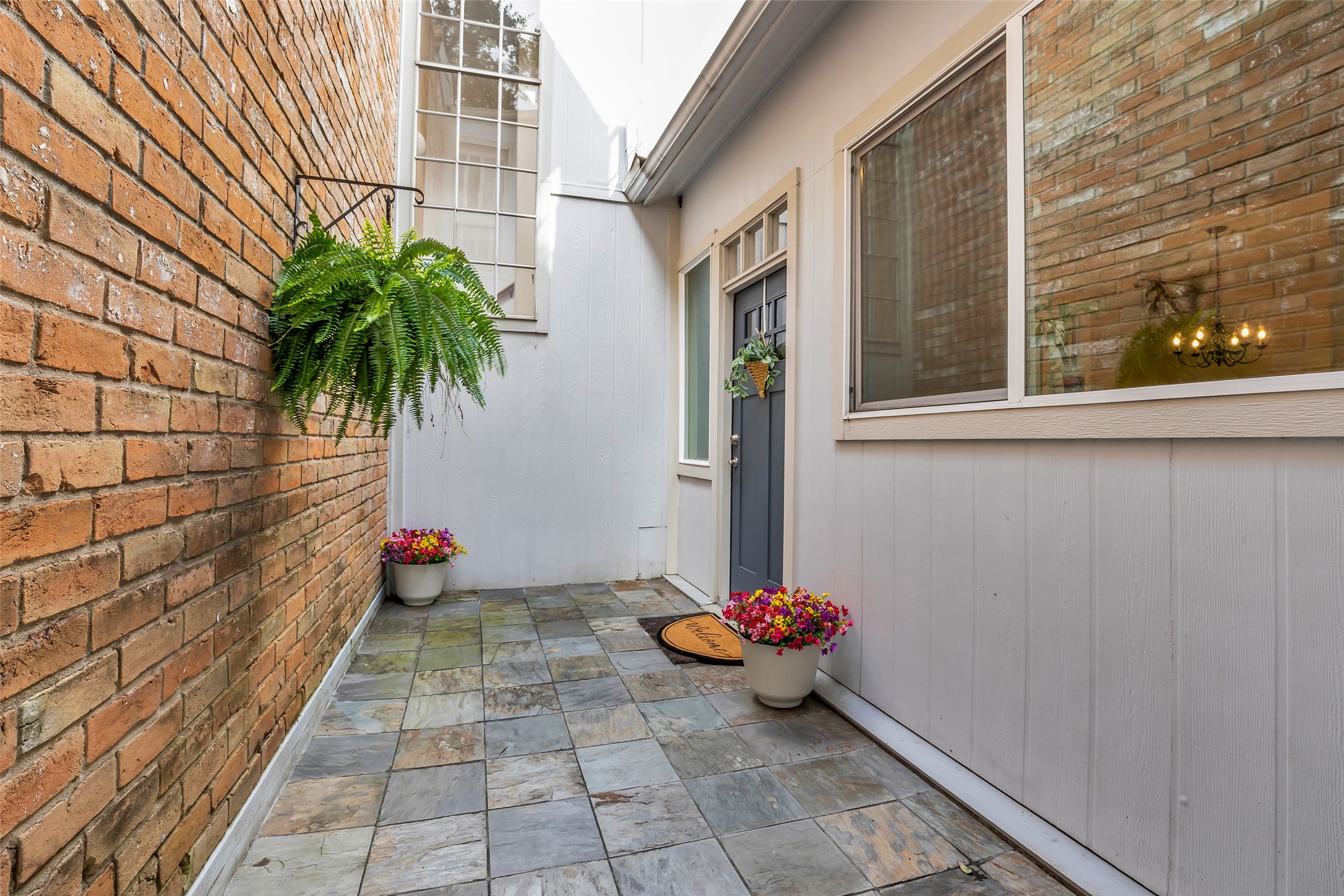 7485 Brompton Street, Unit 7485 Houston, TX 77025 - Photo 2 of 43 Private gated entrance offering both security and charm, with ample space to create your own outdoor retreat. Whether used as a cozy patio, container garden, or entertaining space, this versatile area provides the perfect setting to relax, unwind, and enjoy outdoor living in privacy.