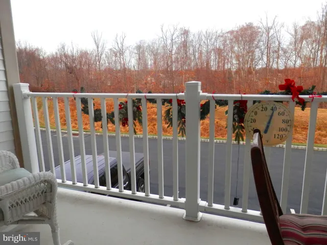 a living room with furniture and flowers