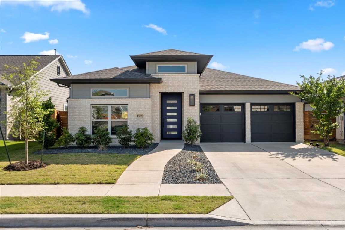 a front view of a house with yard