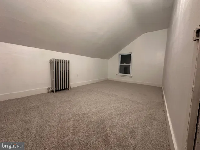 a view of a big house with a big yard