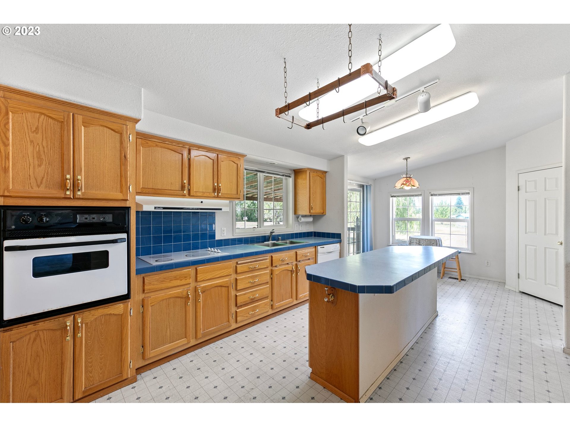 35796 Enterprise Road Creswell, OR 97426 - Photo 5 of 44 a kitchen with stainless steel appliances granite countertop a sink stove and refrigerator