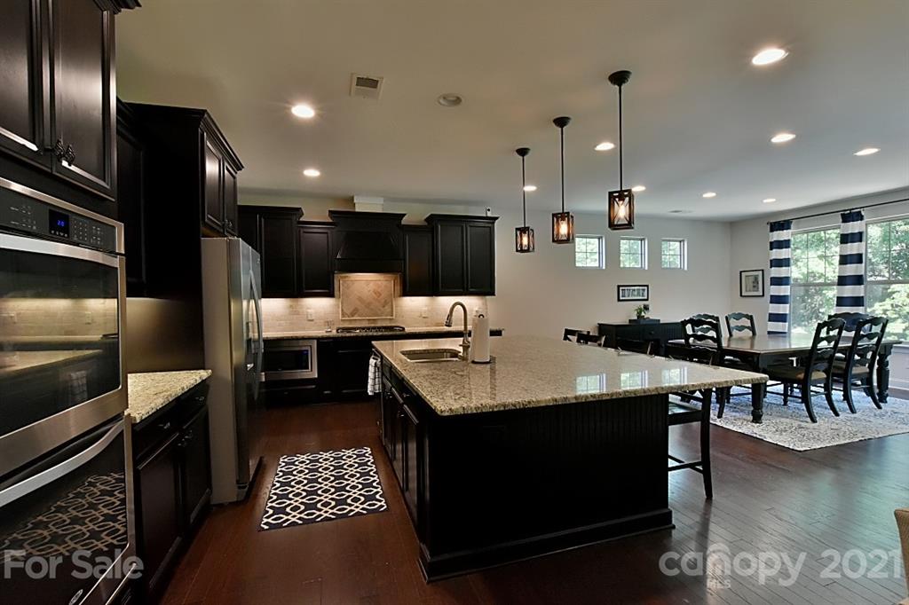 922 Castlewatch Drive Fort Mill, SC 29708 - Photo 11 of 38 a large kitchen with a table and chairs