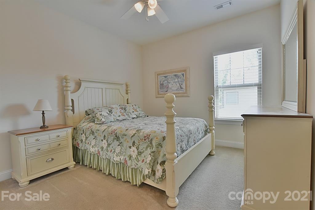 922 Castlewatch Drive Fort Mill, SC 29708 - Photo 16 of 38 a bedroom with a bed and a cabinets