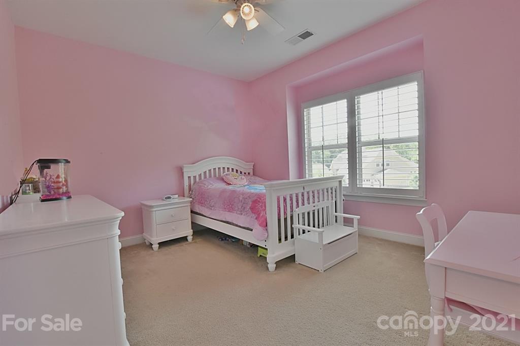 922 Castlewatch Drive Fort Mill, SC 29708 - Photo 17 of 38 a bedroom with a bed and a window