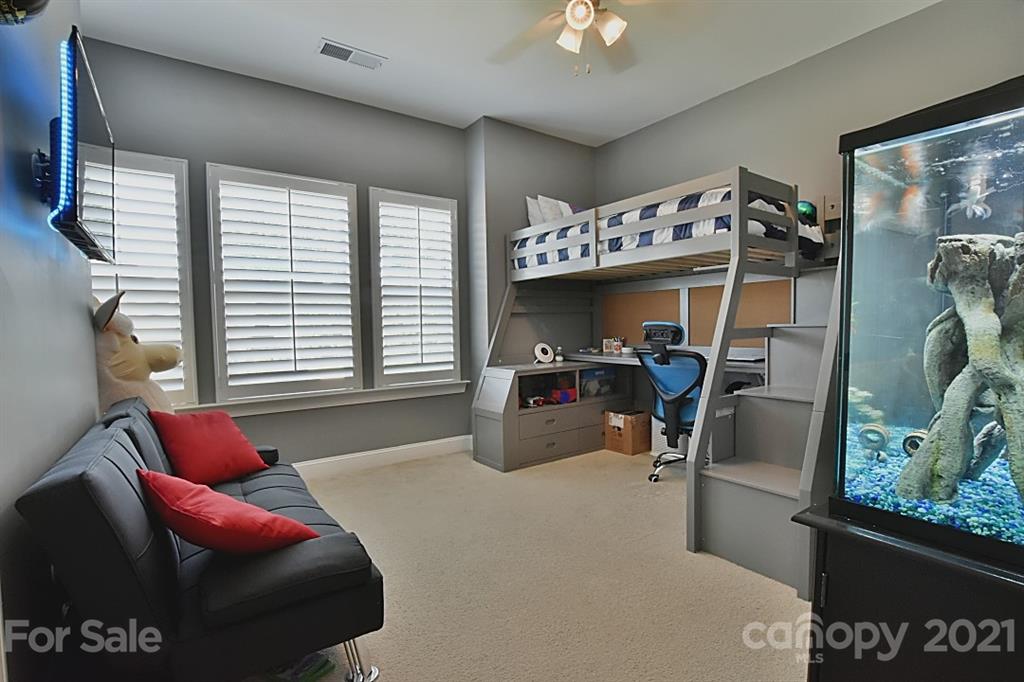 922 Castlewatch Drive Fort Mill, SC 29708 - Photo 19 of 38 a bedroom with furniture and a large window