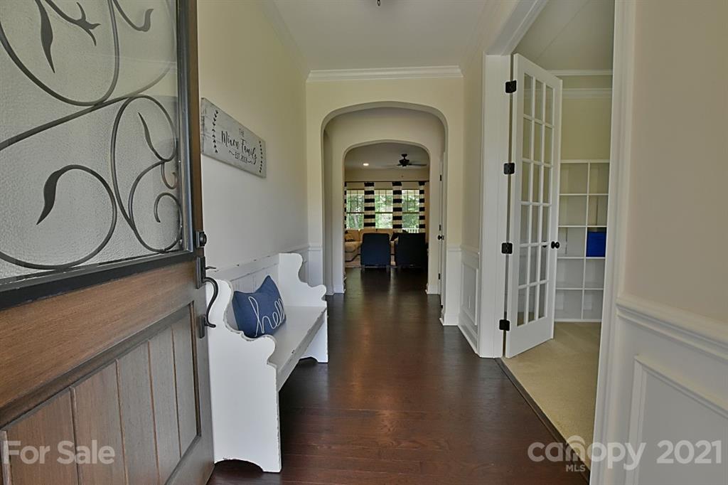 922 Castlewatch Drive Fort Mill, SC 29708 - Photo 3 of 38 a view of entryway and hall with wooden floor