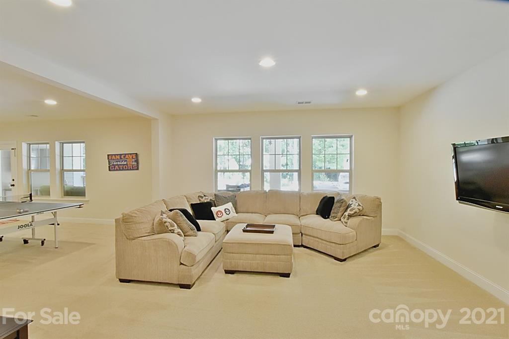 922 Castlewatch Drive Fort Mill, SC 29708 - Photo 23 of 38 a living room with furniture and a flat screen tv
