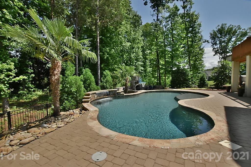 922 Castlewatch Drive Fort Mill, SC 29708 - Photo 30 of 38 a view of a swimming pool with a yard and sitting area
