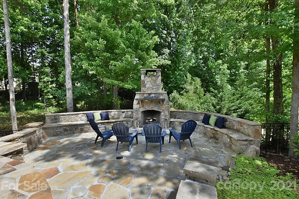 922 Castlewatch Drive Fort Mill, SC 29708 - Photo 32 of 38 a view of a chairs and tables in the backyard