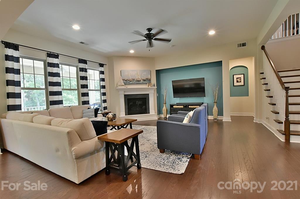922 Castlewatch Drive Fort Mill, SC 29708 - Photo 6 of 38 a living room with furniture and a flat screen tv