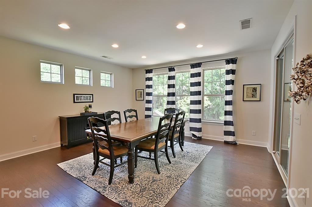 922 Castlewatch Drive Fort Mill, SC 29708 - Photo 7 of 38 a view of a a dining room with furniture window and wooden floor