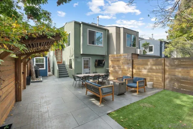 a backyard of a house with seating space