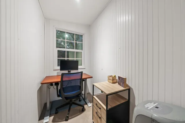 a view of a workspace with furniture