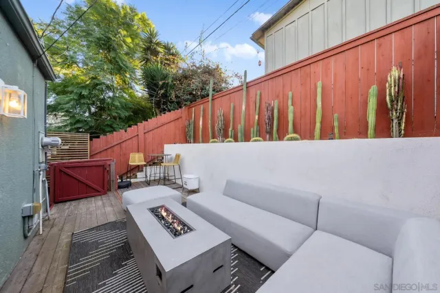 a backyard of a house with outdoor seating