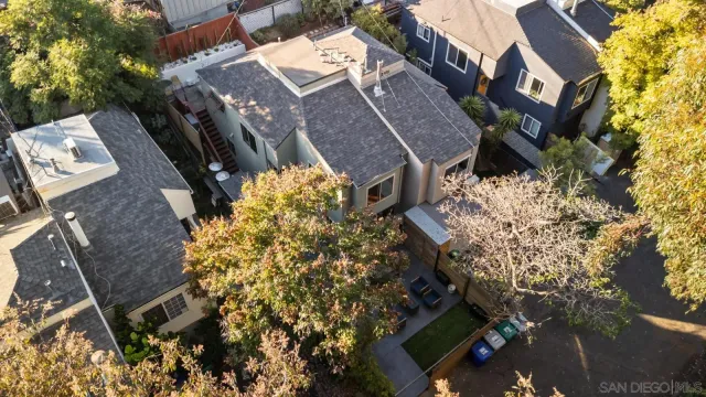 an aerial view of a residential apartment building with a yard