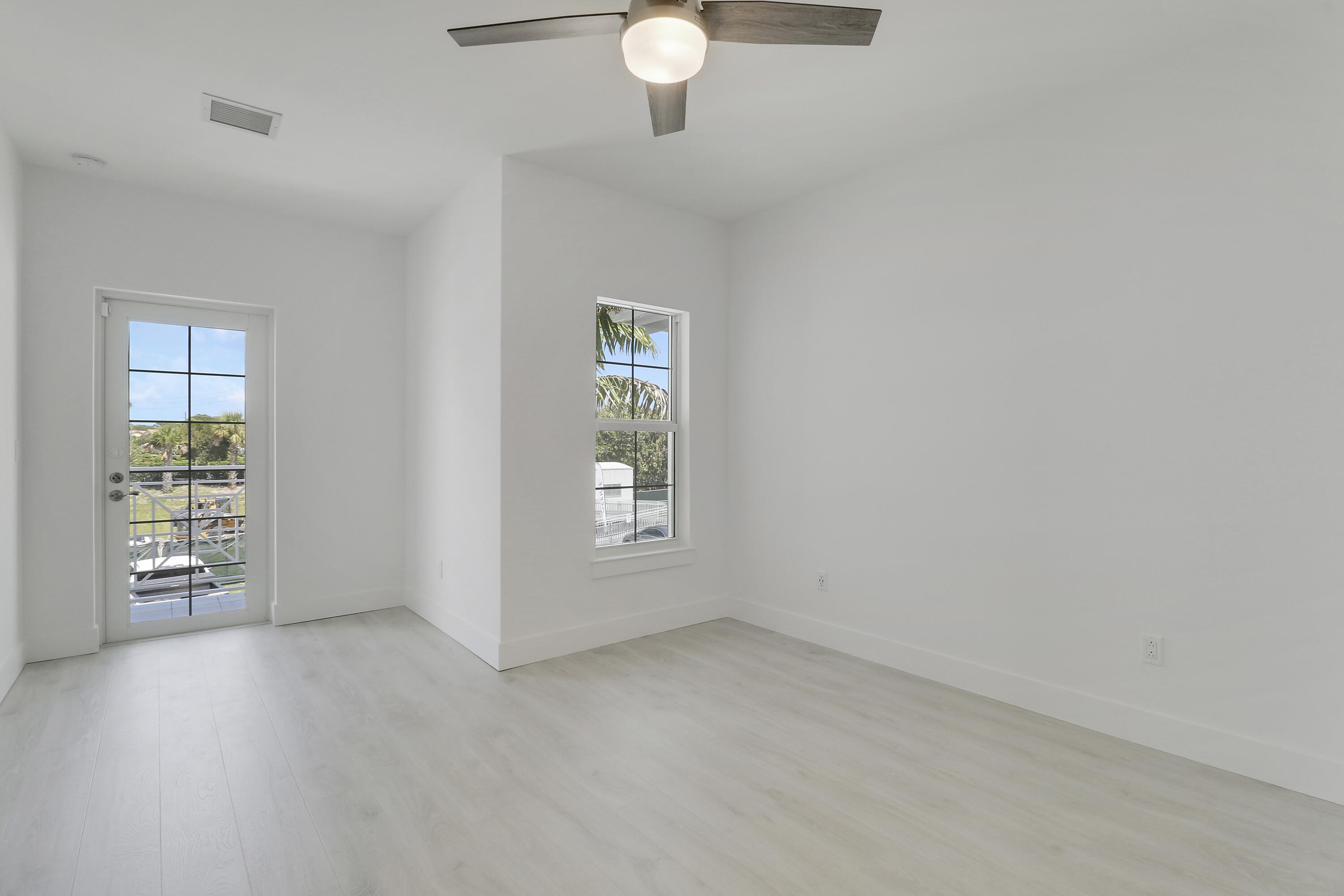 120 Water Pointe Place, Unit 3 Jupiter, FL 33477 - Photo 11 of 36 a view of an empty room with a window