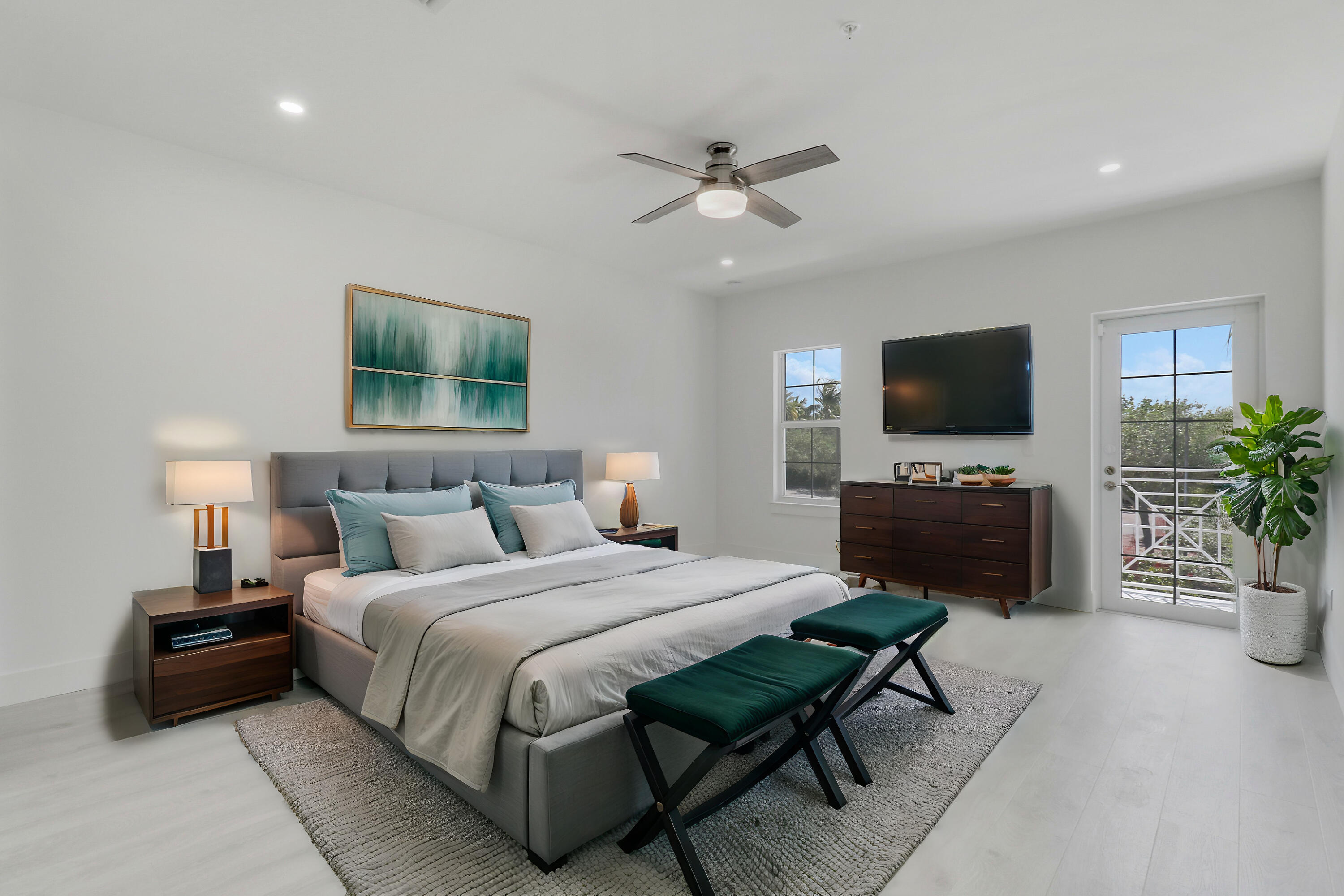 120 Water Pointe Place, Unit 3 Jupiter, FL 33477 - Photo 17 of 36 a bedroom with a bed and a flat screen tv