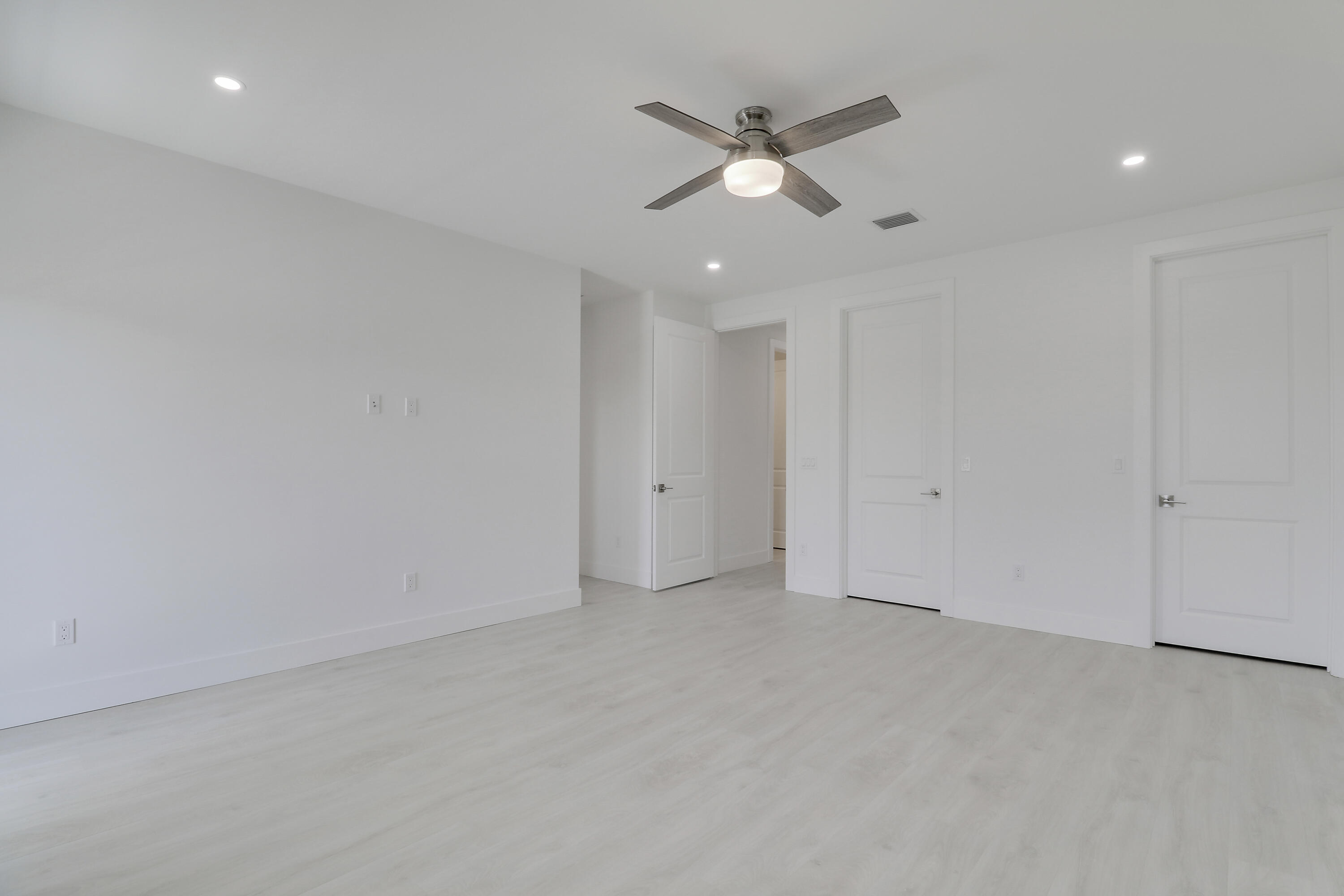 120 Water Pointe Place, Unit 3 Jupiter, FL 33477 - Photo 18 of 36 an empty room with a fan and a window