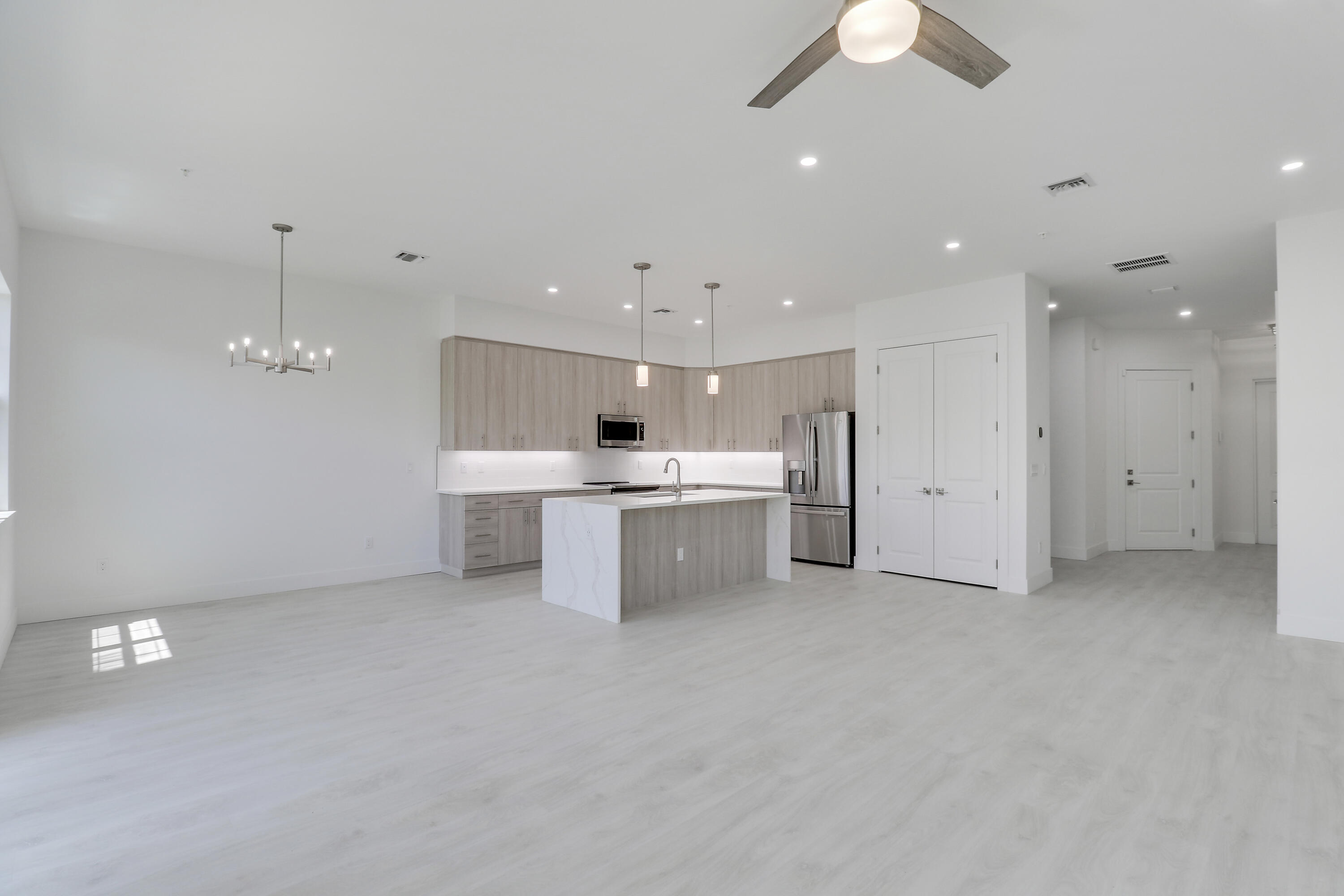 120 Water Pointe Place, Unit 3 Jupiter, FL 33477 - Photo 26 of 36 a view of a kitchen with a sink and a refrigerator