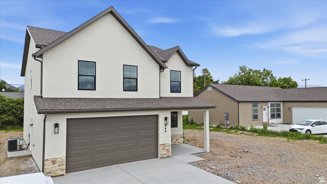 844 North 400 West Logan, UT 84321 - Photo 35 of 43 Contemporary two-story residence featuring light stucco siding and a dark shingle roof