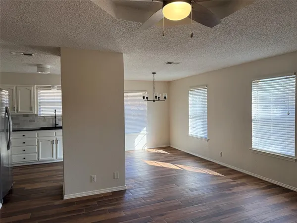 a view of a kitchen cabinets and wooden floor