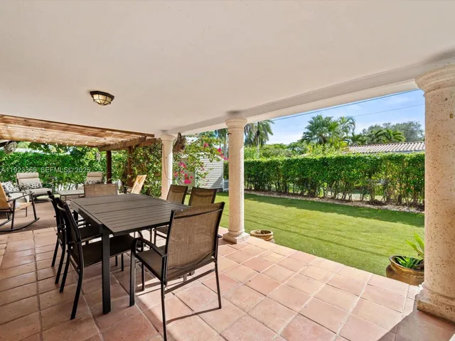 a view of a swimming pool with an outdoor space