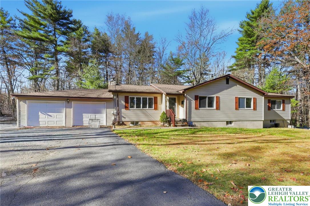 104 Scotch Pine Court Dingmans Ferry, PA 18328 - Photo 1 of 41 a view of a house with a yard