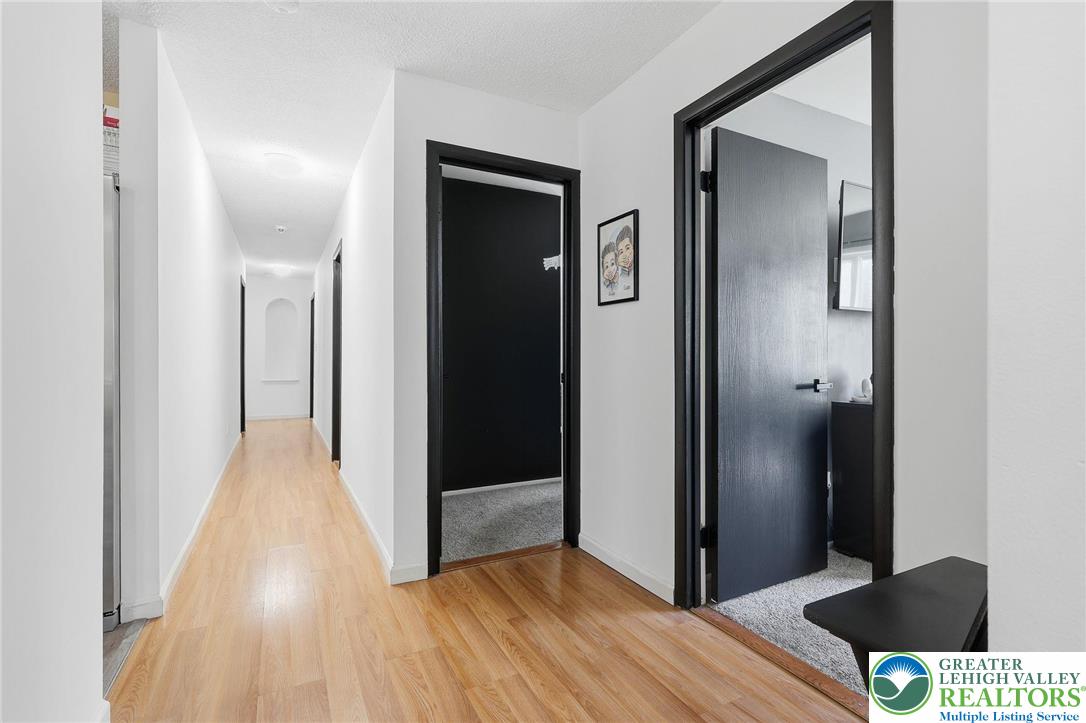 104 Scotch Pine Court Dingmans Ferry, PA 18328 - Photo 13 of 41 a view of a hallway with wooden floor
