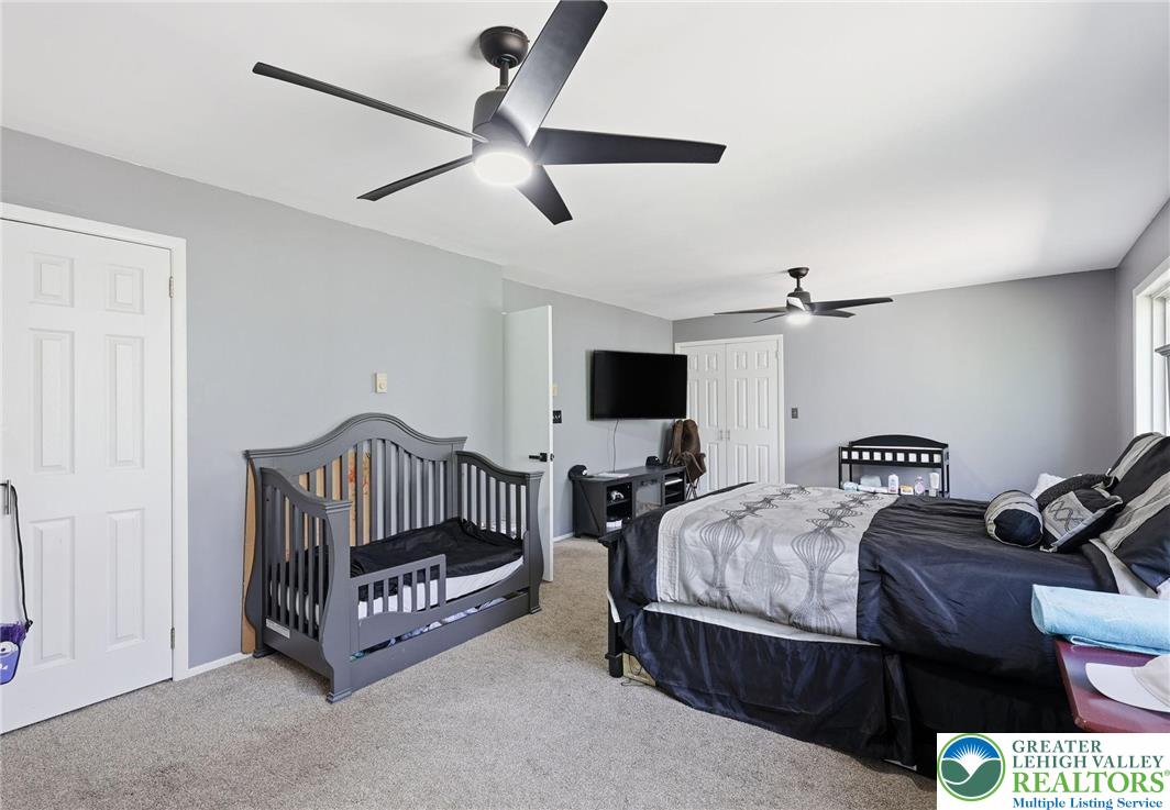 104 Scotch Pine Court Dingmans Ferry, PA 18328 - Photo 15 of 41 a bedroom with bed and a window