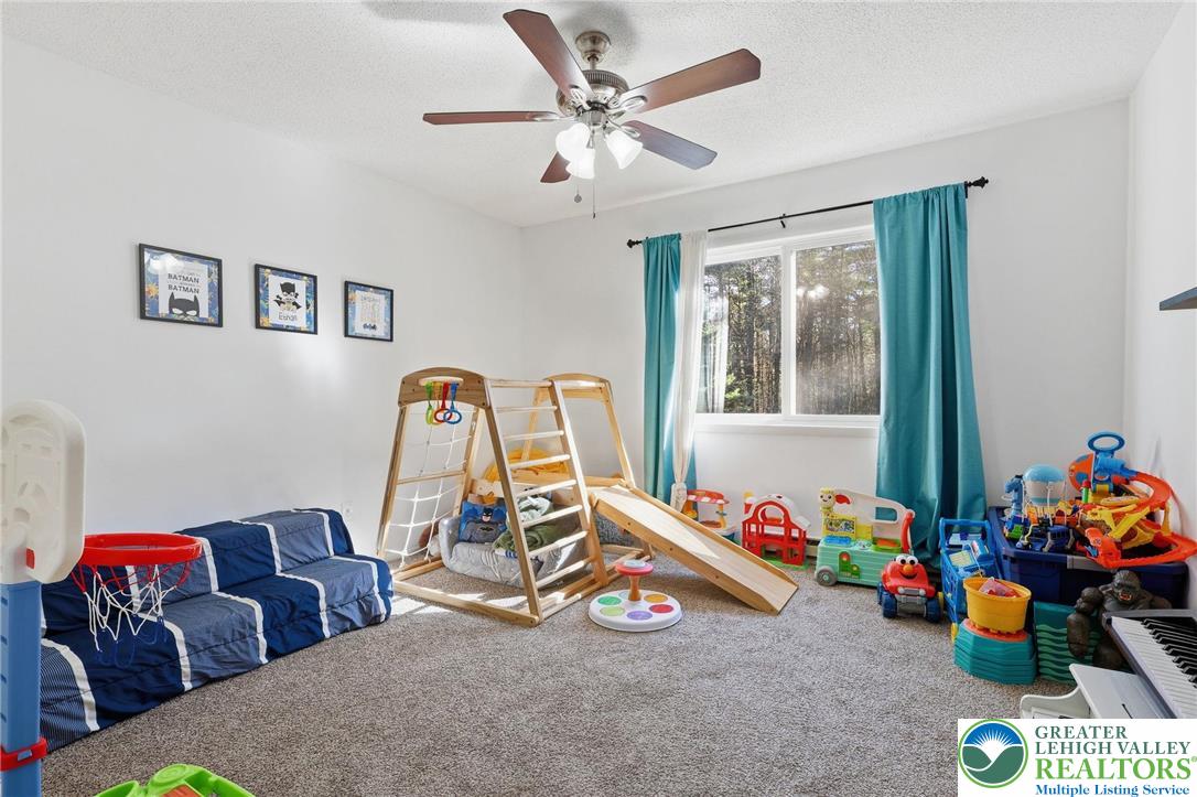 104 Scotch Pine Court Dingmans Ferry, PA 18328 - Photo 18 of 41 a bedroom with furniture and a gym equipment