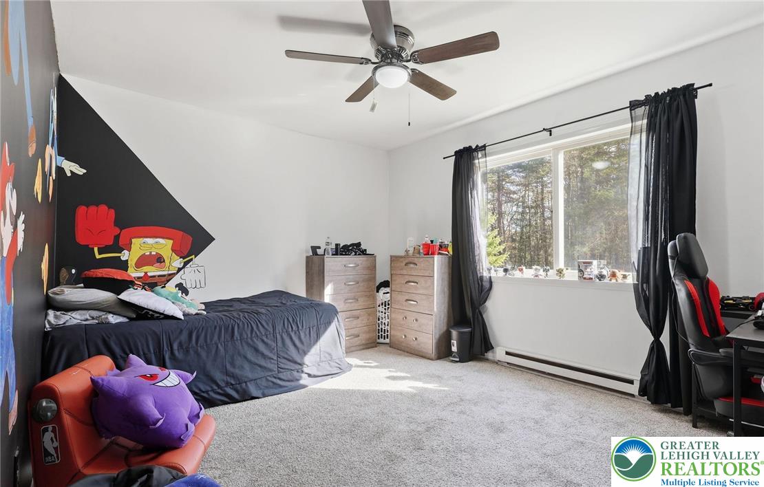 104 Scotch Pine Court Dingmans Ferry, PA 18328 - Photo 22 of 41 a bedroom with furniture and a window
