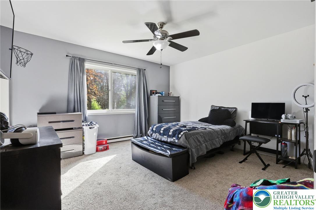 104 Scotch Pine Court Dingmans Ferry, PA 18328 - Photo 24 of 41 a bedroom with bed and a window