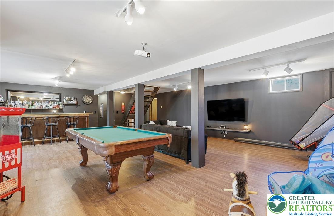 104 Scotch Pine Court Dingmans Ferry, PA 18328 - Photo 26 of 41 a room with furniture and a flat screen tv