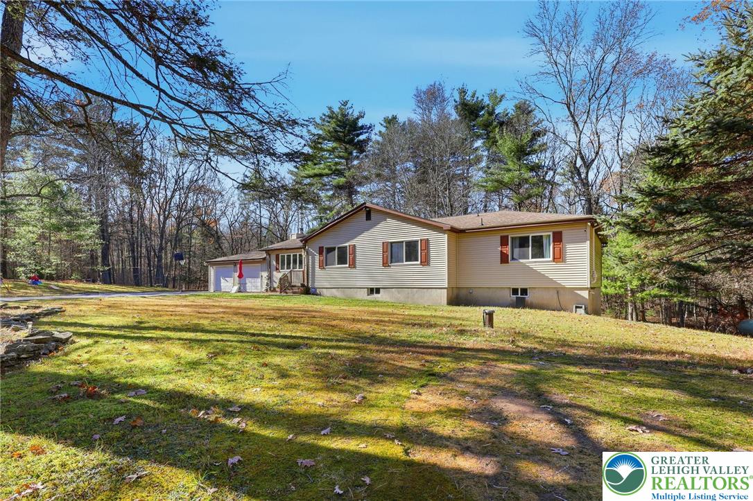 104 Scotch Pine Court Dingmans Ferry, PA 18328 - Photo 3 of 41 a house view with a outdoor space