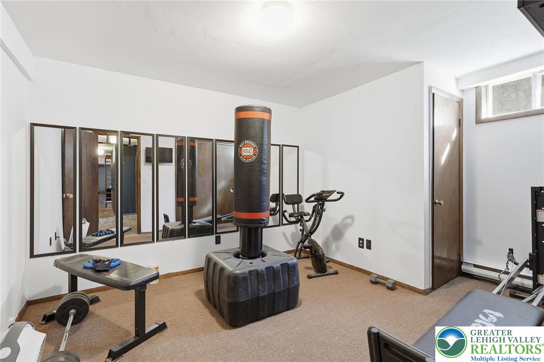 104 Scotch Pine Court Dingmans Ferry, PA 18328 - Photo 34 of 41 a living room with furniture