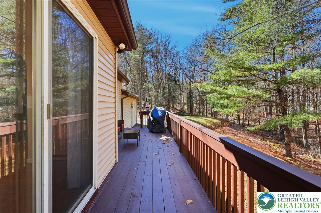 104 Scotch Pine Court Dingmans Ferry, PA 18328 - Photo 36 of 41 a view of balcony with wooden floor and fence