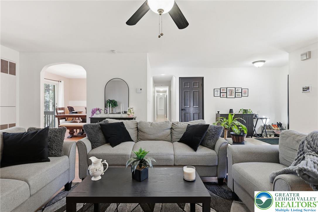 104 Scotch Pine Court Dingmans Ferry, PA 18328 - Photo 5 of 41 a living room with furniture and a large window