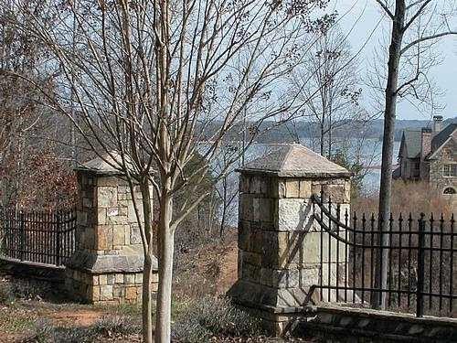9030 Old Terry Ford Road Gainesville, GA 30506 - Photo 2 of 21 a front view of a house with iron fence