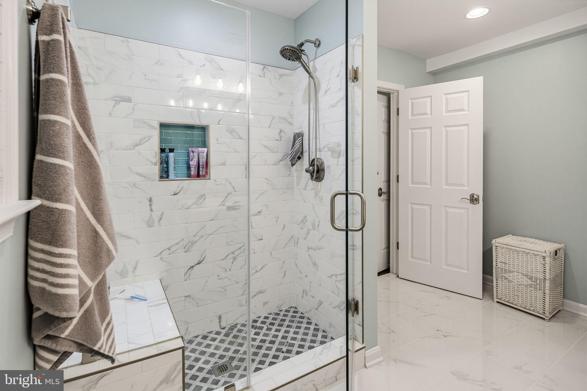 9242 Spring Valley Road Ellicott City, MD 21043 - Photo 18 of 52 Amazing shower with seat and glass enclosure