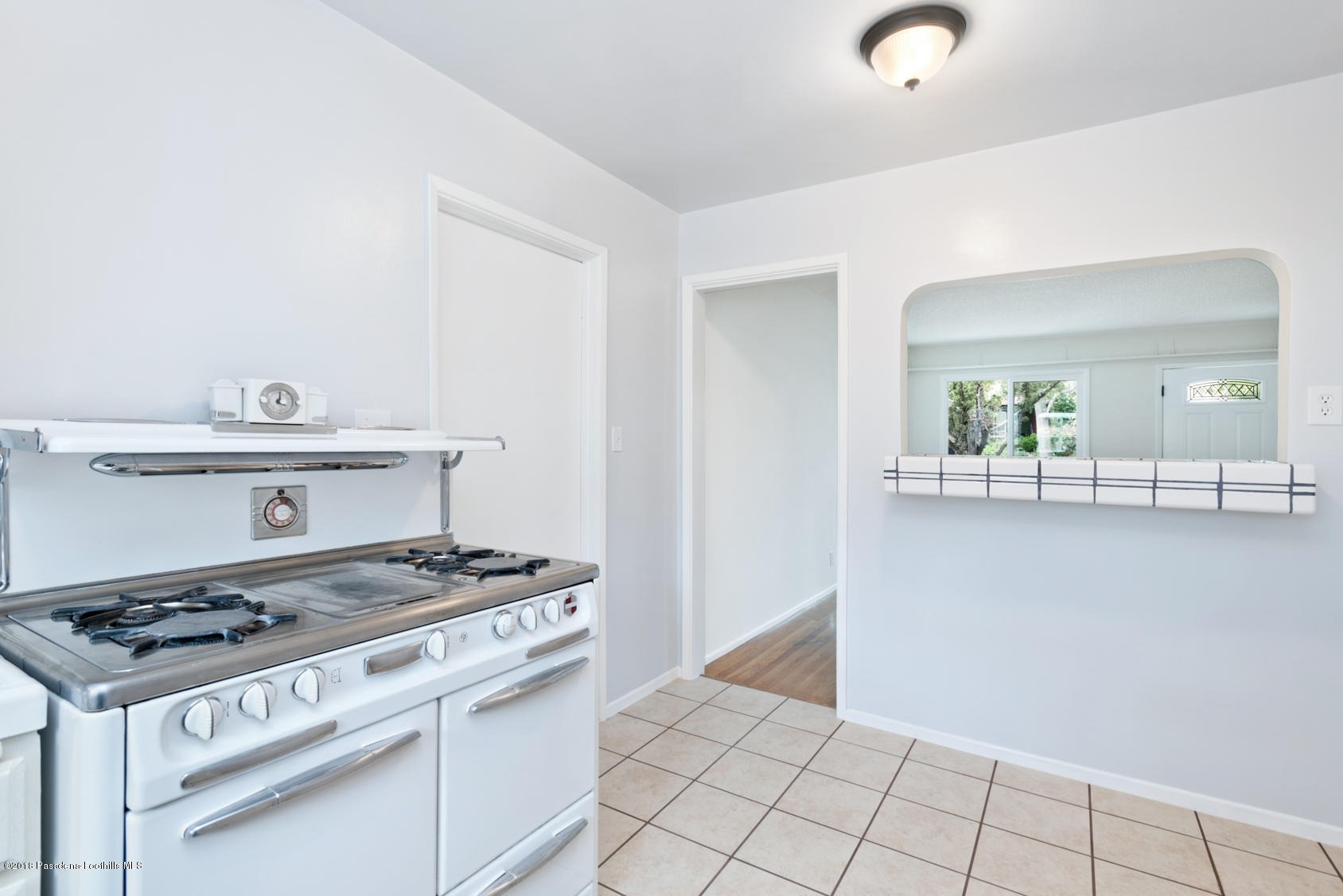 4286 Aralia Road Altadena, CA 91001 - Photo 15 of 22 a kitchen with granite countertop a stove and a sink