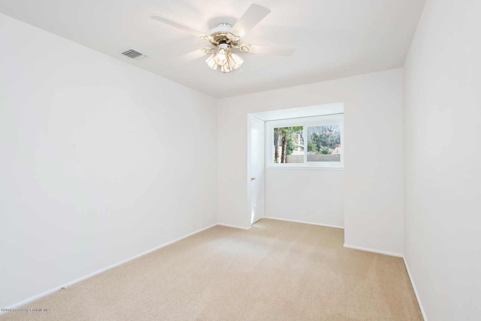 4286 Aralia Road Altadena, CA 91001 - Photo 16 of 22 an empty room with windows and fan