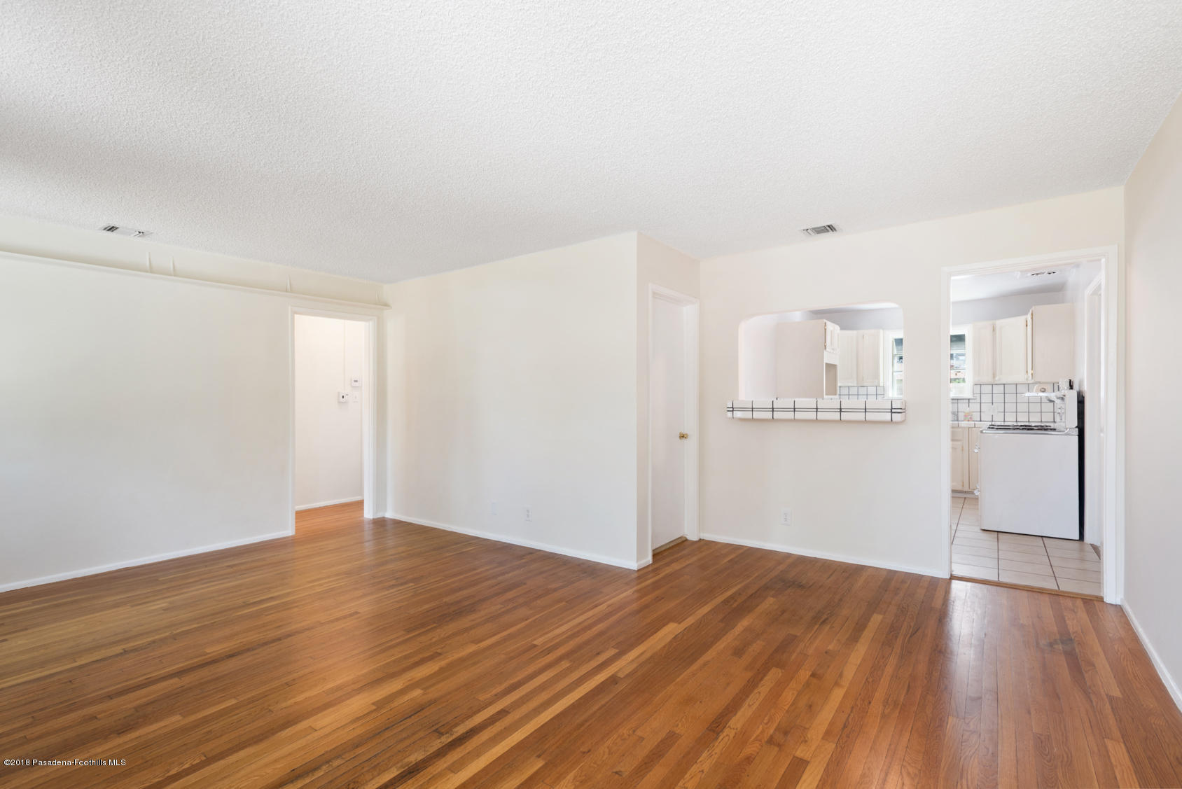 4286 Aralia Road Altadena, CA 91001 - Photo 3 of 22 a view of wooden floor and windows in a room
