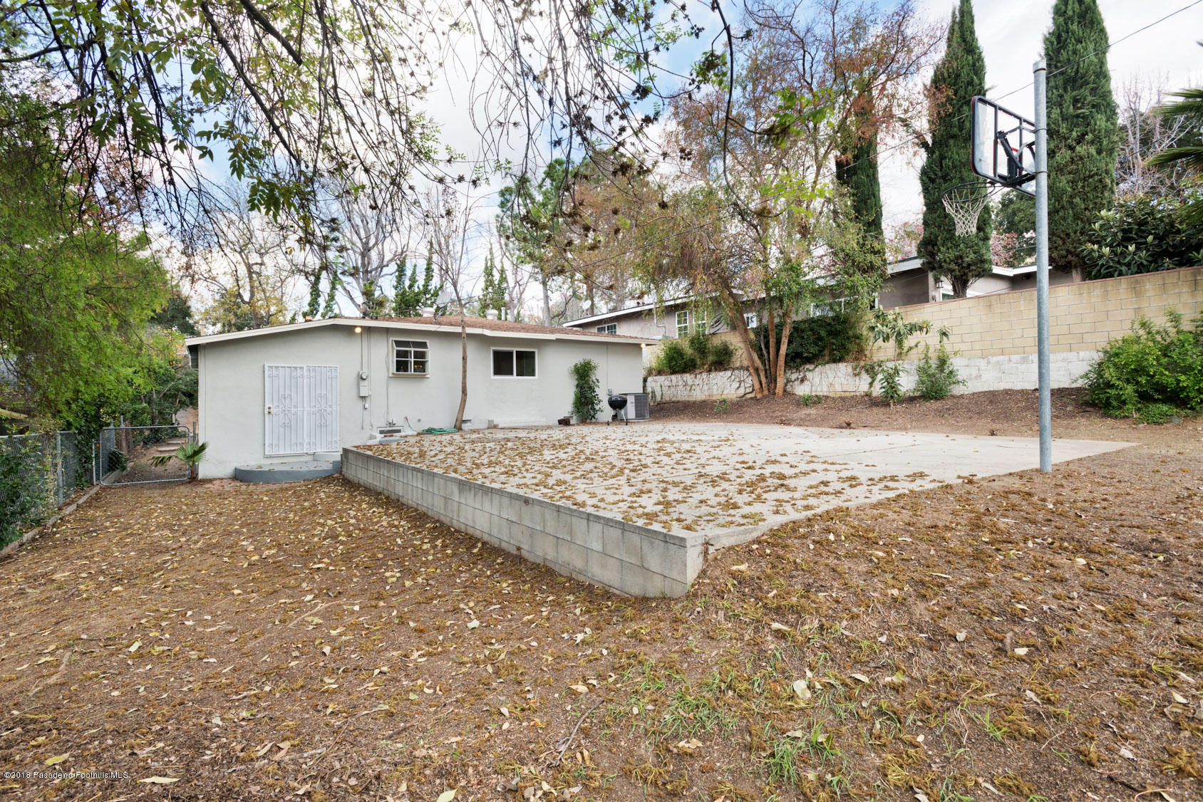 4286 Aralia Road Altadena, CA 91001 - Photo 22 of 22 a view of a house with a yard covered with snow in the background