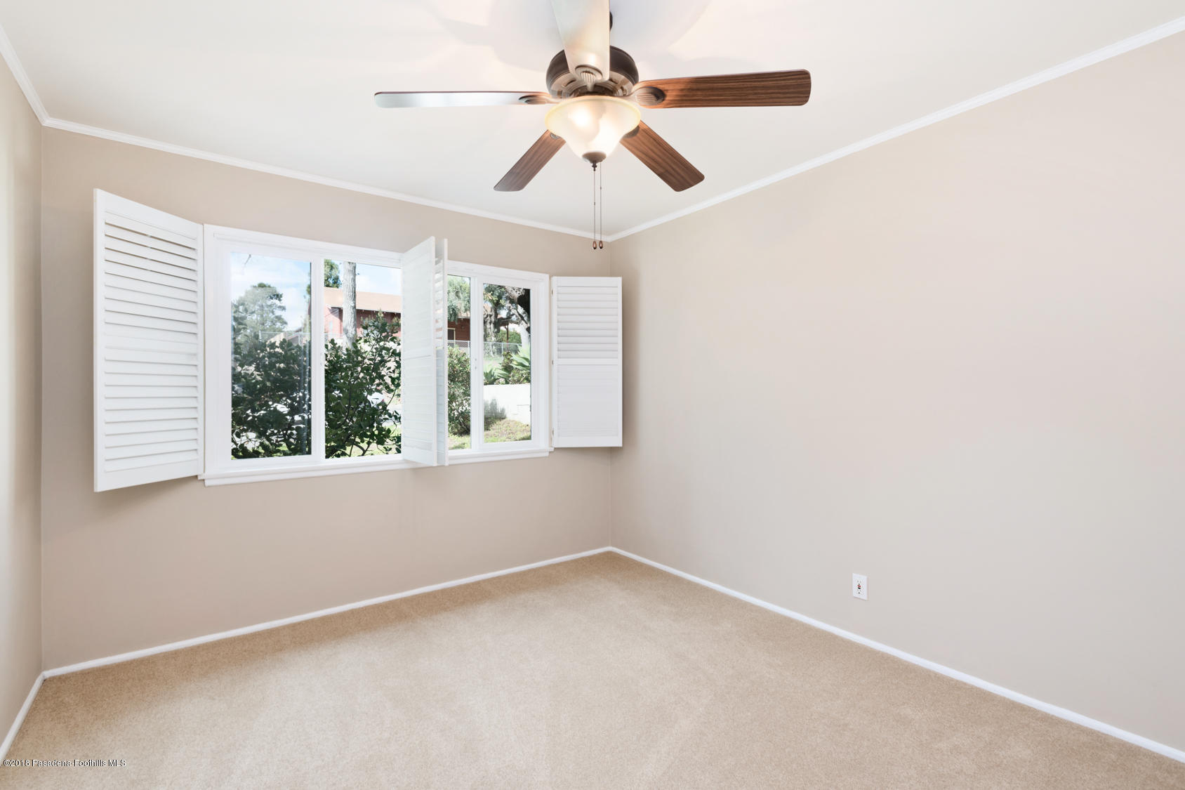 4286 Aralia Road Altadena, CA 91001 - Photo 6 of 22 an empty room with windows and fan