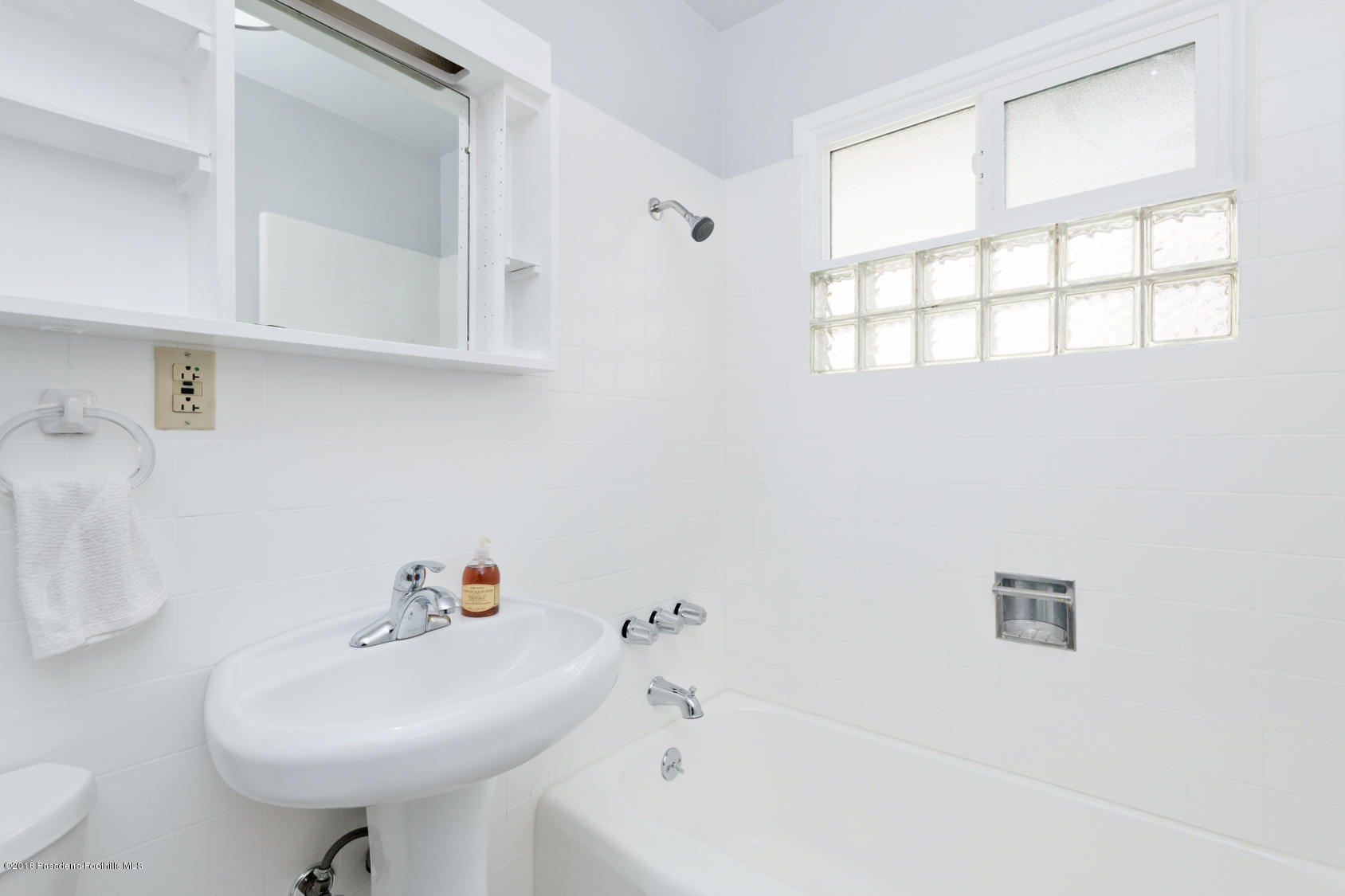 4286 Aralia Road Altadena, CA 91001 - Photo 7 of 22 a bathroom with a sink a toilet and mirror