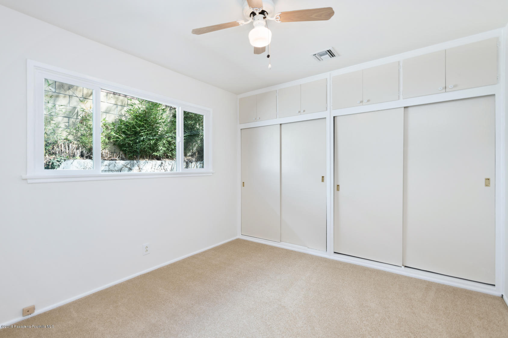 4286 Aralia Road Altadena, CA 91001 - Photo 8 of 22 a view of an empty room with a window