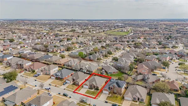 an aerial view of residential building and parking space